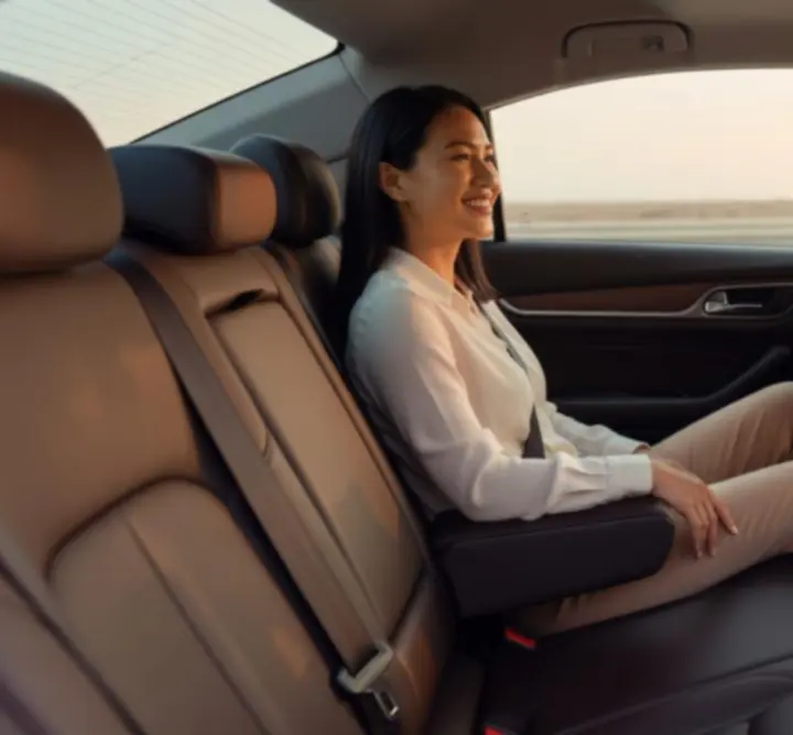 Passenger enjoying a safe and comfortable taxi ride with HOI & KI LTD